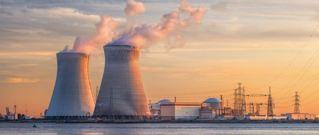 Late,Afternoon,Scene,With,View,On,Riverbank,With,Nuclear,Reactor